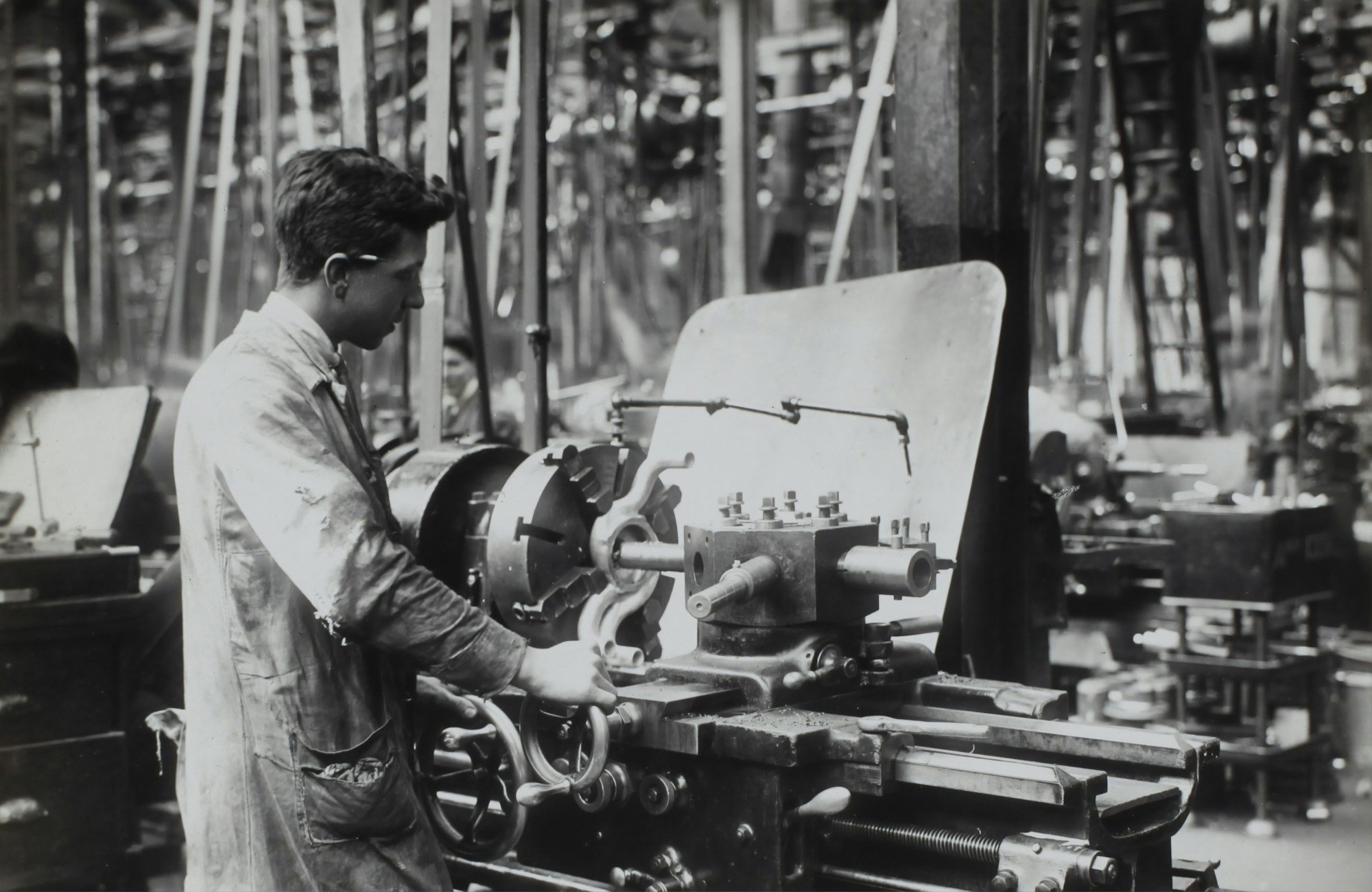 A worker making an aircraft engine in England, circa 1918.