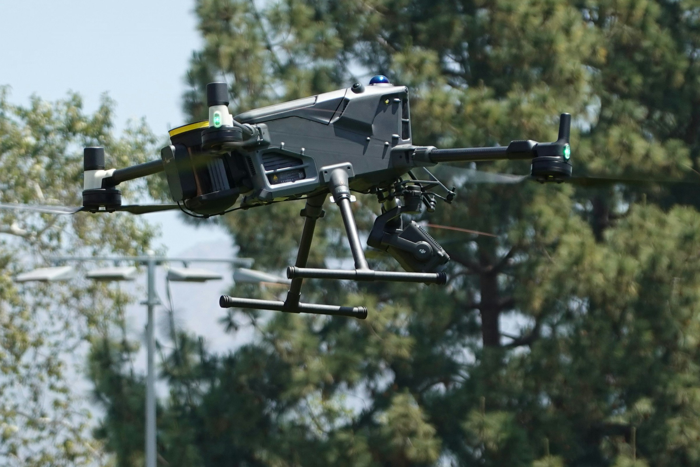 An industrial quadcopter in flight during a field test.