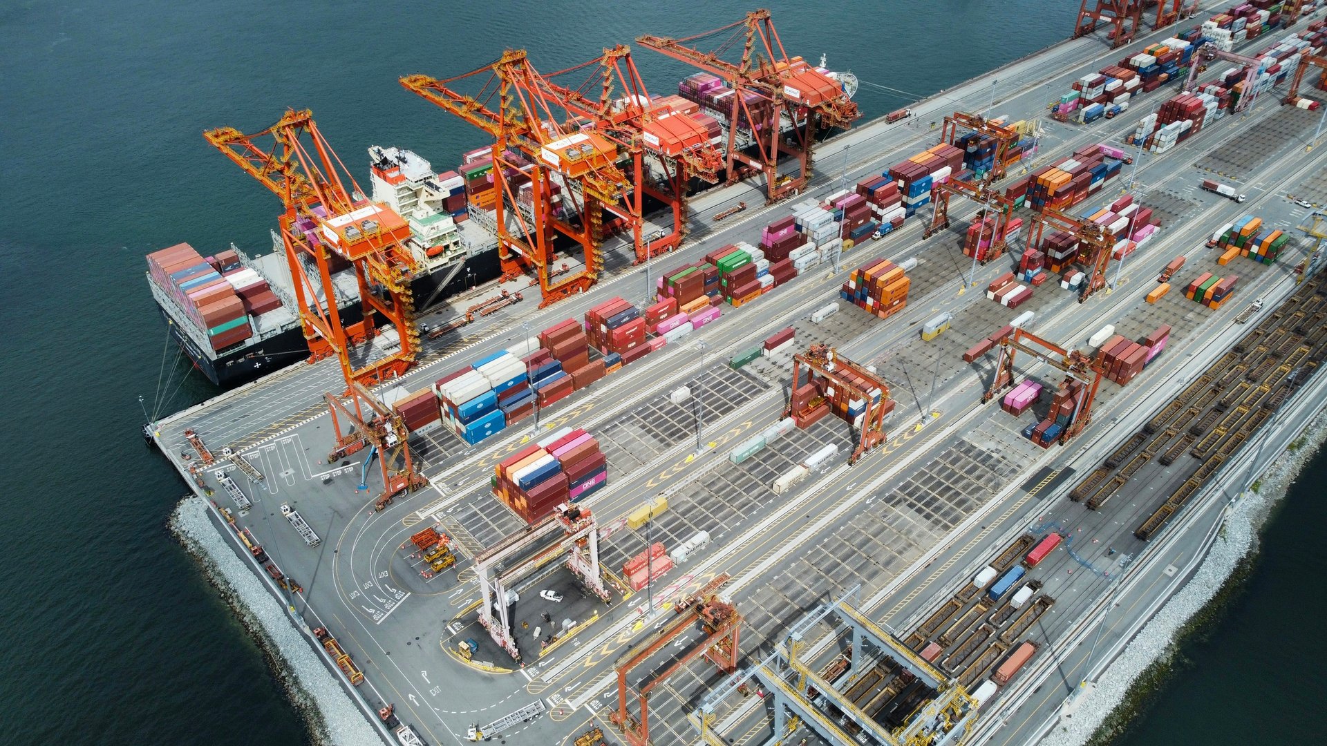 Container ships and cranes at the Port of Vancouver, photographed from above.