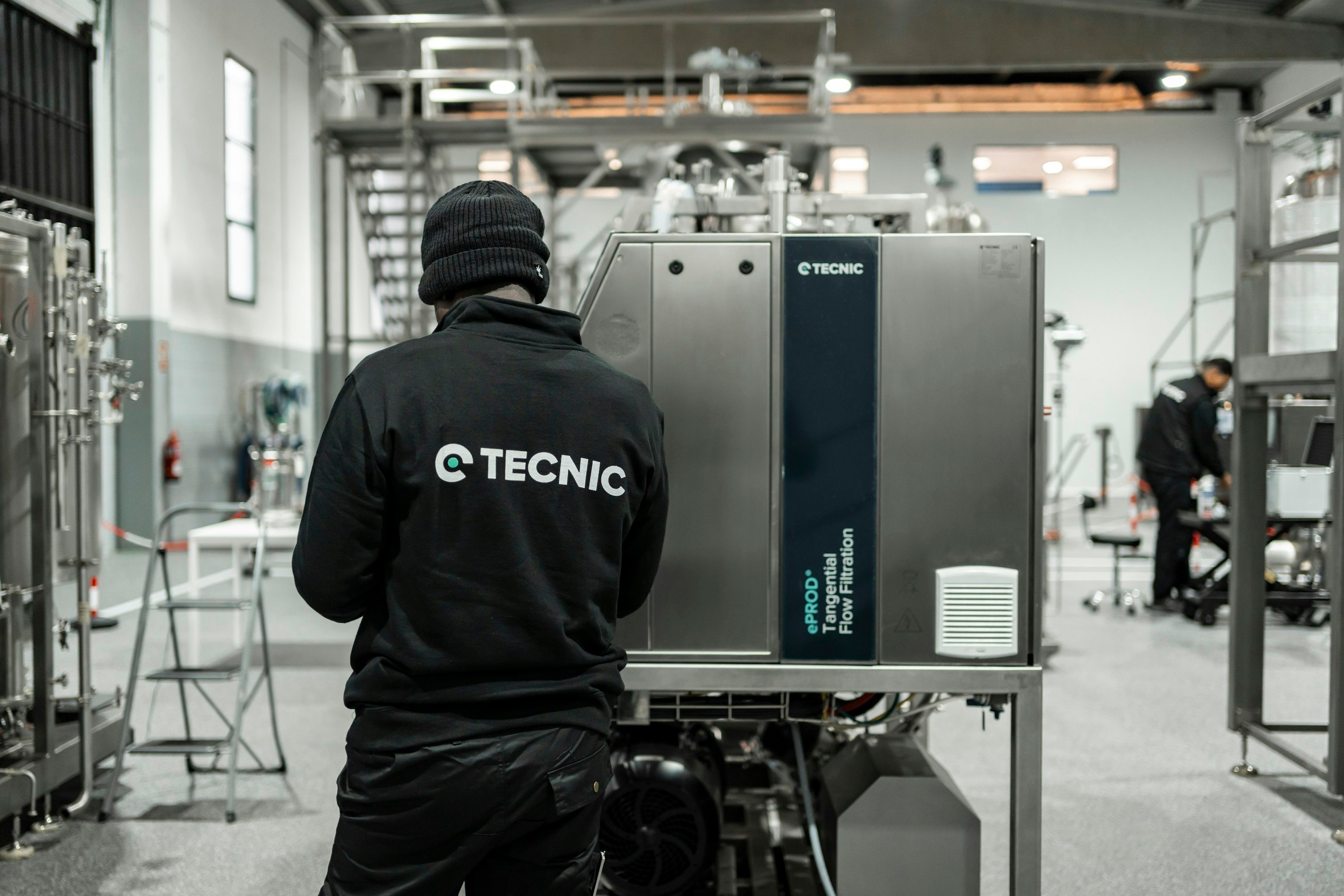 A technician inspecting industrial process equipment.